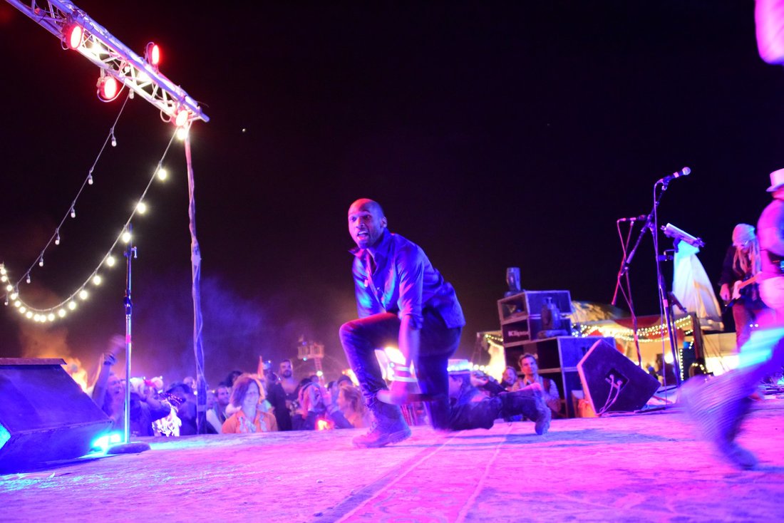 Ishmon Brown performing outdoors at night