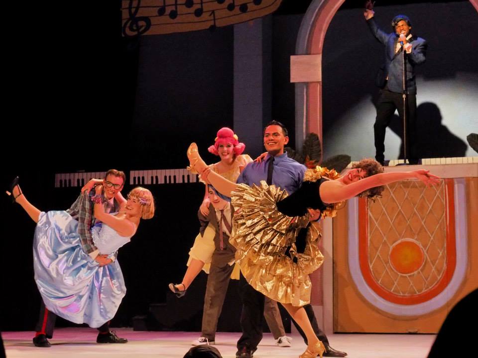 Ishmon Brown with a cast in a stage performance