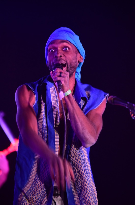 Ishmon Brown singing in blue stagewear